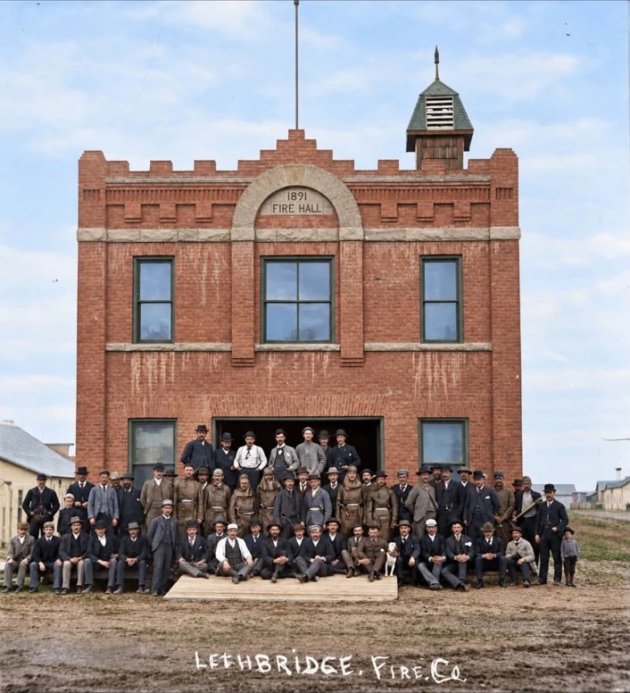 User-supplied colourized image of the Lethbridge Fire Company in front of a hall labelled 1891 Fire Hall